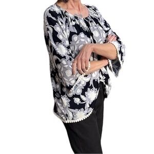 Black and white top with flair sleeve and detail edge